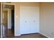Bedroom with closet and natural light from the doorway at 3519 W Libby St, Glendale, AZ 85308