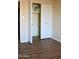 Empty closet with bi-fold doors and additional storage space on top shelf at 3519 W Libby St, Glendale, AZ 85308