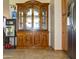 Dining room with ornate wood china cabinet next to a stainless steel refrigerator at 3519 W Libby St, Glendale, AZ 85308