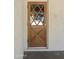 A beautiful wooden front door with decorative glass insets at 3519 W Libby St, Glendale, AZ 85308
