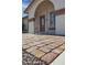 Charming gated front porch with tiled walkway leading to the front door at 3519 W Libby St, Glendale, AZ 85308