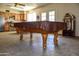Spacious game room with a pool table, jukebox, and bright lighting at 3519 W Libby St, Glendale, AZ 85308