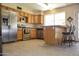 Traditional-style kitchen featuring wood cabinets and stainless steel appliances at 3519 W Libby St, Glendale, AZ 85308