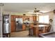 Spacious kitchen with stainless steel appliances, tile floors, and wood cabinets at 3519 W Libby St, Glendale, AZ 85308