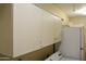 Laundry area features cabinet storage for all your washing needs at 3519 W Libby St, Glendale, AZ 85308