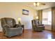 Cozy living room with comfortable recliners and ample natural light at 3519 W Libby St, Glendale, AZ 85308