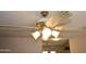 Ornate ceiling fan with light fixtures in living room at 3519 W Libby St, Glendale, AZ 85308