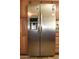 Stainless steel refrigerator with water dispenser, and cabinet surround at 3519 W Libby St, Glendale, AZ 85308