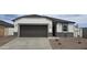 Charming single-story home with a two-car garage and rock accents at 35523 N Breezy Ln, San Tan Valley, AZ 85140