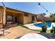 Landscaped backyard featuring a pool, patio, and desert plants, perfect for enjoying the outdoors at 3742 E Sandy Way, Gilbert, AZ 85297