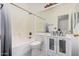 This bathroom has a marble countertop sink and a tub with shower at 3742 E Sandy Way, Gilbert, AZ 85297