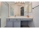 Bright bathroom featuring tiled floor, a shower, and vanity with storage and mirror at 3742 E Sandy Way, Gilbert, AZ 85297