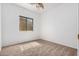 This bedroom has neutral walls and carpet with a window at 3742 E Sandy Way, Gilbert, AZ 85297