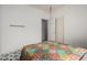 Simple bedroom with a colorful comforter, black and white tile floor, and lots of natural light at 3742 E Sandy Way, Gilbert, AZ 85297