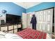 Bedroom features a neutral color scheme, storage, and a sliding door closet at 3742 E Sandy Way, Gilbert, AZ 85297