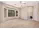 Bright bedroom with an en-suite bathroom featuring an archway entrance at 3742 E Sandy Way, Gilbert, AZ 85297