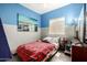 This bedroom has bright and cheery colors, a plush bed, and is illuminated with natural light at 3742 E Sandy Way, Gilbert, AZ 85297