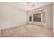 Spacious bedroom featuring neutral carpet, ample windows, and a ceiling fan at 3742 E Sandy Way, Gilbert, AZ 85297