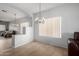 Dining area with bright light, tile floors, and direct access to the open-concept living room at 3742 E Sandy Way, Gilbert, AZ 85297