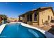 Backyard swimming pool view showcasing the home's exterior and outdoor entertainment area at 3742 E Sandy Way, Gilbert, AZ 85297