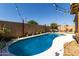 Sparkling backyard pool surrounded by a concrete patio and string lights, creating a relaxing oasis at 3742 E Sandy Way, Gilbert, AZ 85297