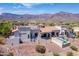 Expansive property with a tile roof, outdoor living spaces, and desert landscape at 4366 S Avenida De Angeles --, Gold Canyon, AZ 85118