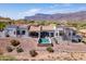 An elevated view of the home showcasing the private pool and patio area with mountain views at 4366 S Avenida De Angeles --, Gold Canyon, AZ 85118