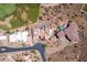 An aerial view shows the luxurious home, pools, and extensive landscaping in the desert community at 4366 S Avenida De Angeles --, Gold Canyon, AZ 85118