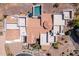 An aerial view shows the home, its orange tile roof, the patios, and the backyard swimming pool at 4366 S Avenida De Angeles --, Gold Canyon, AZ 85118