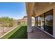 Covered back porch features an artificial lawn with mountain views and golf course at 4366 S Avenida De Angeles --, Gold Canyon, AZ 85118