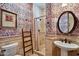 A unique bathroom with floral wallpaper and a walk-in shower is quite charming at 4366 S Avenida De Angeles --, Gold Canyon, AZ 85118