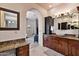 Bathroom with vanity, granite counters, vessel sink, and access to living space beyond at 4366 S Avenida De Angeles --, Gold Canyon, AZ 85118