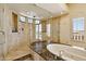 Bathroom with a glass enclosed shower, soaking tub, and bright natural light with outside views at 4366 S Avenida De Angeles --, Gold Canyon, AZ 85118
