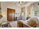 Bedroom features vaulted ceilings, a ceiling fan, soft colors, and a large window overlooking nature at 4366 S Avenida De Angeles --, Gold Canyon, AZ 85118