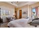 Bedroom with desk, vaulted ceilings, large window with shades, ceiling fan, and neutral decor at 4366 S Avenida De Angeles --, Gold Canyon, AZ 85118