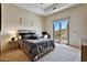 Well-lit bedroom features a private balcony and views of the surrounding desert landscape at 4366 S Avenida De Angeles --, Gold Canyon, AZ 85118
