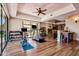 This large exercise room has wood flooring, a ceiling fan, and a sliding glass door at 4366 S Avenida De Angeles --, Gold Canyon, AZ 85118
