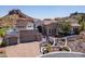 Stunning desert home with a mountain backdrop, three-car garage, and desert landscaping at 4366 S Avenida De Angeles --, Gold Canyon, AZ 85118