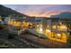 Beautiful desert estate with a pool, outdoor living space, and desert landscaping at twilight at 4366 S Avenida De Angeles --, Gold Canyon, AZ 85118