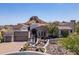 Beautiful Southwestern-style home with stone accents and meticulously landscaped front yard at 4366 S Avenida De Angeles --, Gold Canyon, AZ 85118