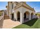 The home has a charming covered patio, artificial lawn, and a staircase leading to the rooftop at 4366 S Avenida De Angeles --, Gold Canyon, AZ 85118