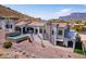 Side-view of luxury home featuring a private pool, arched doorways, and a tile roof at 4366 S Avenida De Angeles --, Gold Canyon, AZ 85118