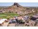 Stunning home features a red tile roof, a three-car garage, and an adjacent golf course at 4366 S Avenida De Angeles --, Gold Canyon, AZ 85118