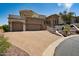 Attractive home featuring a spacious driveway, three-car garage, and beautifully landscaped front yard for added elegance at 4366 S Avenida De Angeles --, Gold Canyon, AZ 85118