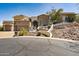 Inviting home featuring a landscaped front yard, a three-car garage, and an elegant entrance for instant curb appeal at 4366 S Avenida De Angeles --, Gold Canyon, AZ 85118