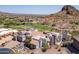 The beautiful home has a red tile roof, patios, lovely landscaping, and is next to a golf course at 4366 S Avenida De Angeles --, Gold Canyon, AZ 85118