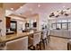 Open-concept kitchen with a breakfast bar, stainless steel appliances, and seamless flow to the living area at 4366 S Avenida De Angeles --, Gold Canyon, AZ 85118
