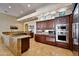 Well-equipped kitchen with stainless steel appliances, custom cabinetry, and a granite island at 4366 S Avenida De Angeles --, Gold Canyon, AZ 85118