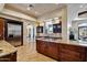 Bright kitchen with stainless steel appliances, custom cabinets, and access to living area at 4366 S Avenida De Angeles --, Gold Canyon, AZ 85118