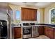 The spacious laundry room features stainless steel appliances, granite counters, and lovely outdoor views at 4366 S Avenida De Angeles --, Gold Canyon, AZ 85118